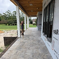 IMG_1083 The front porch done in Travertine tile. The scale of the house is misleading. The first floor has 10 foot cielings, and the windows and doors are a foot taller...