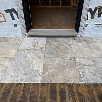IMG_1084 The side porch done in Travertine tile.